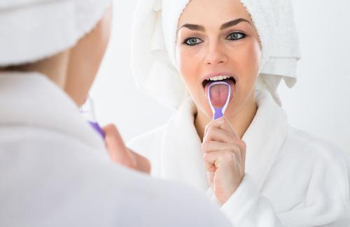 Ayurveda cleaning the tongue